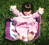 Nightgown, "sleeping bag" on lawn.